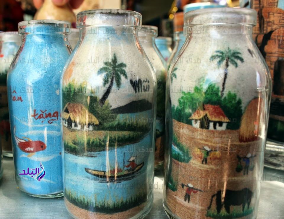 تعرف على طريقة الرسم بالرمال داخل الزجاجات فيديو وصور